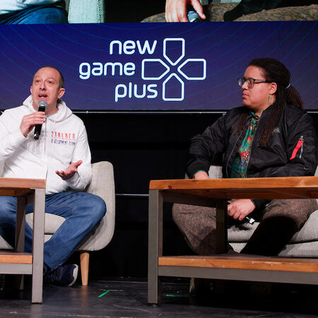 Jonas on stage, interviewing Agostino Simonetta on the stage of New Game Plus